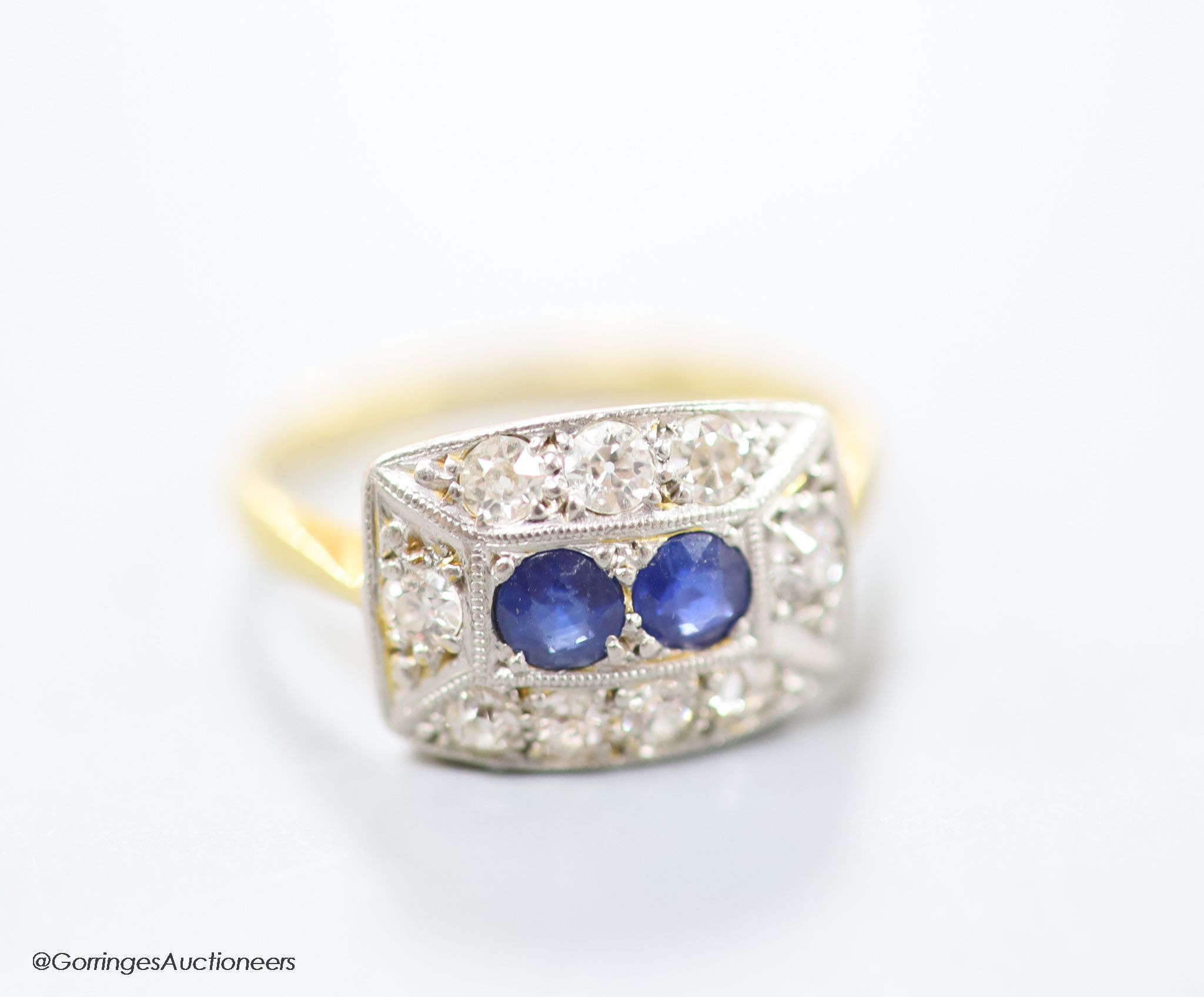 A 1930's/1940's 18ct & Pt, sapphire and diamond set shaped rectangular cluster ring, size M, gross weight 3 grams.